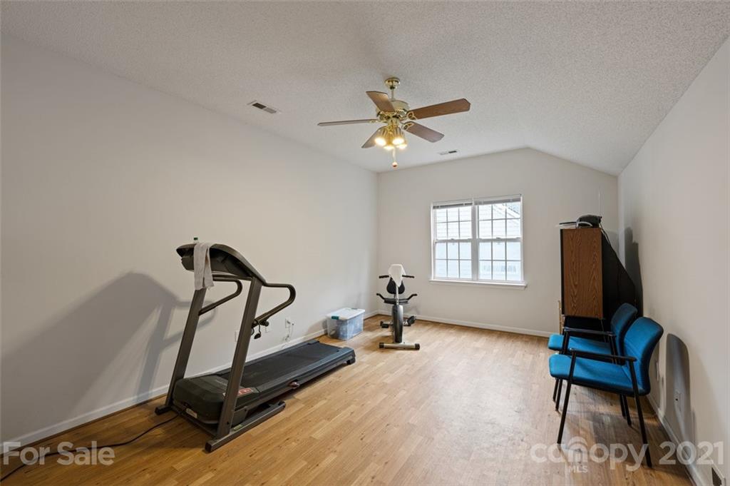 7414 Reedy Creek Road Charlotte, NC 28215 - Photo 23 of 34 a view of a workspace with furniture and a window