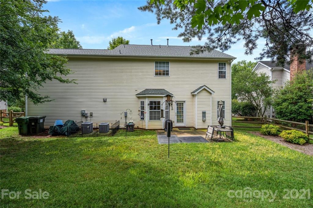 7414 Reedy Creek Road Charlotte, NC 28215 - Photo 29 of 34 a front view of a house with garden and trees