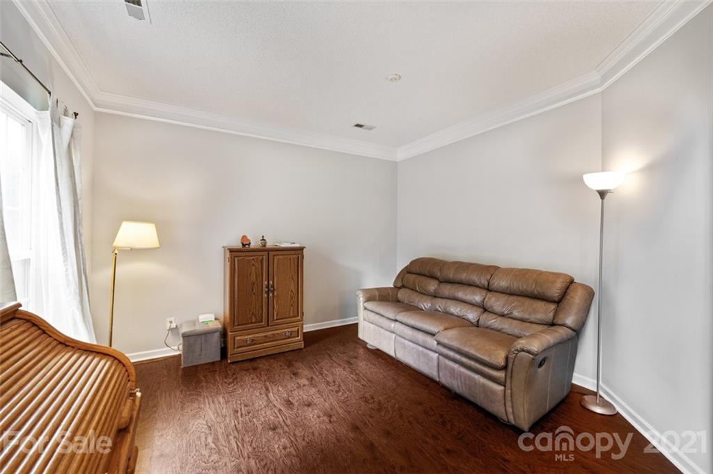 7414 Reedy Creek Road Charlotte, NC 28215 - Photo 6 of 34 a living room with furniture and a ceiling fan