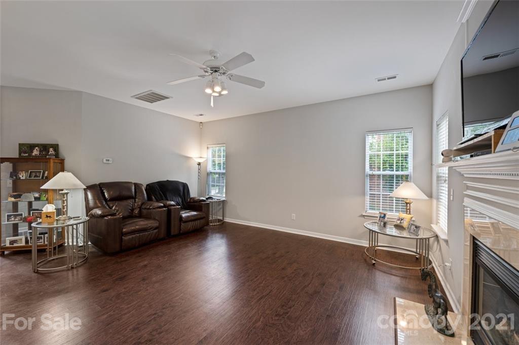 7414 Reedy Creek Road Charlotte, NC 28215 - Photo 7 of 34 a living room with furniture and a fireplace