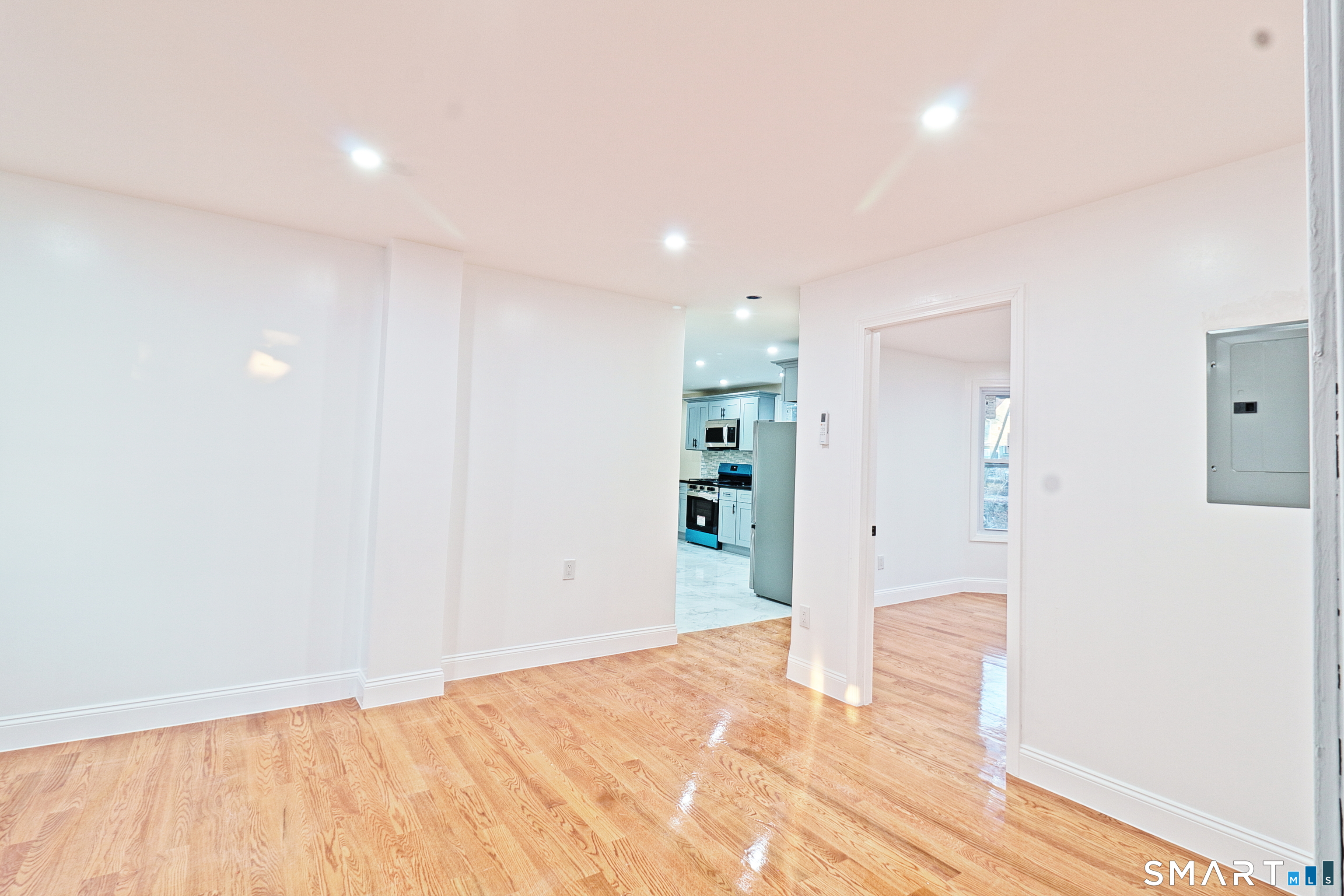 40 Elizabeth Street, Unit 2 Waterbury, CT 06704 - Photo 10 of 11 a view of empty room with wooden floor