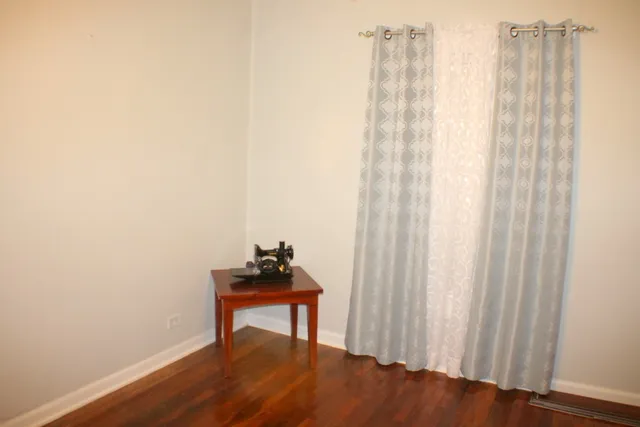 a view of a room with a table and chair