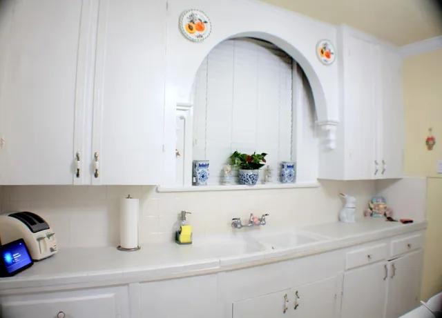 a bathroom with a sink and a window