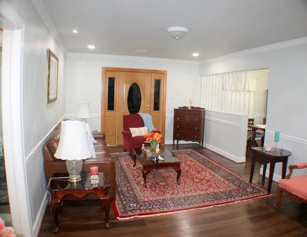 a room with furniture and wooden floor