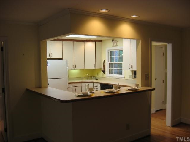 1318 Dogwood Lane Raleigh, NC 27607 - Photo 11 of 11 Open floor plan dining area adjacent to family room and kitchen (sun room could also be formal dining room)