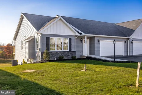 a view of a house with swimming pool and porch