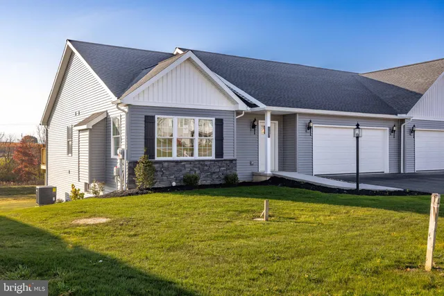 a view of a house with swimming pool and porch