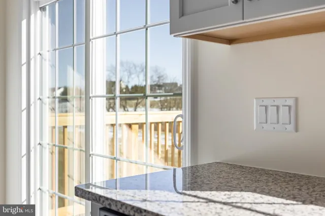 a bedroom with a bed and a couch with window