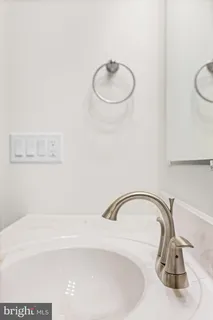 a bathroom with a sink toilet and vanity