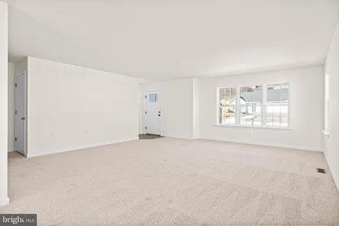a view of a patio with table and chairs