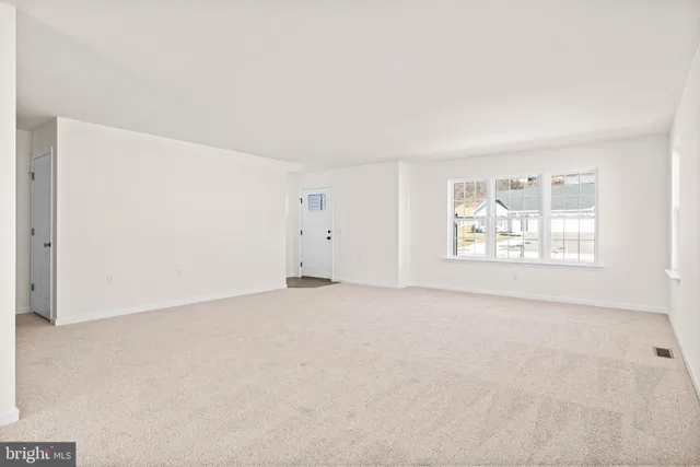 a view of a patio with table and chairs