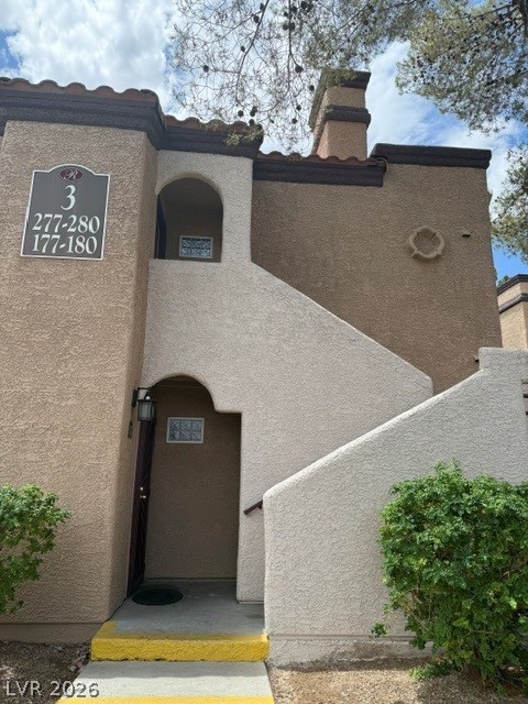 9325 West Desert Inn Road, Unit 278 Las Vegas, NV 89117 - Photo 17 of 17 A classic stucco facade with a terracotta tile roof defines this inviting multi-story residence.
