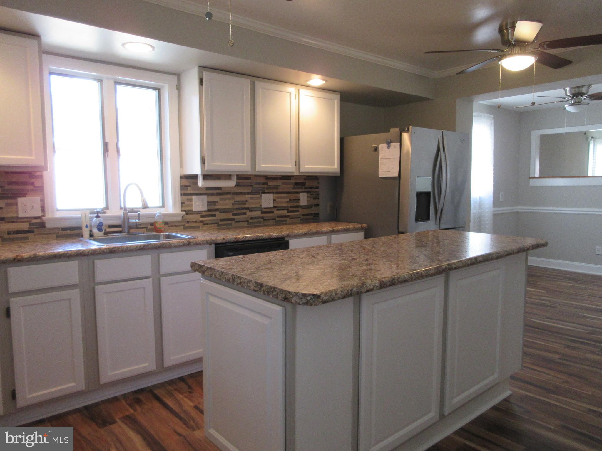 3602 Florida Road Windsor Mill, MD 21244 - Photo 6 of 49 Kitchen island gives you more food prep room!