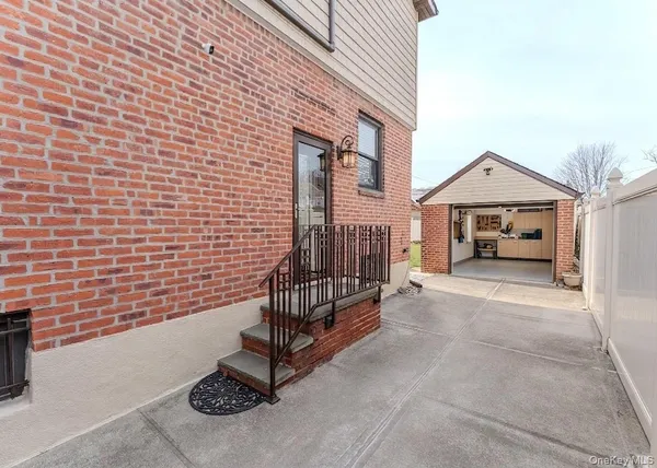 a view of house with outdoor space and parking