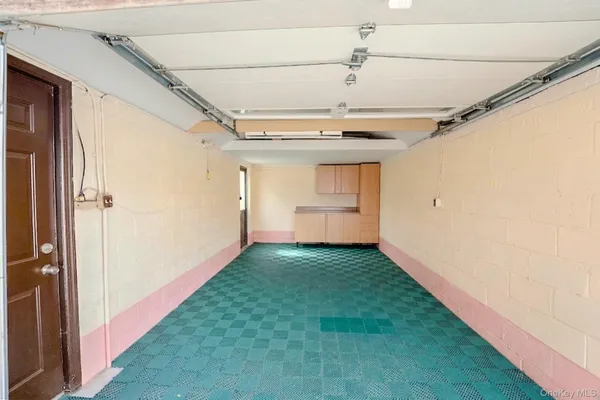 a view of a room with window and a ceiling fan