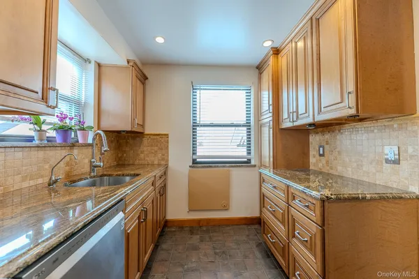 a kitchen that has a sink and a stove