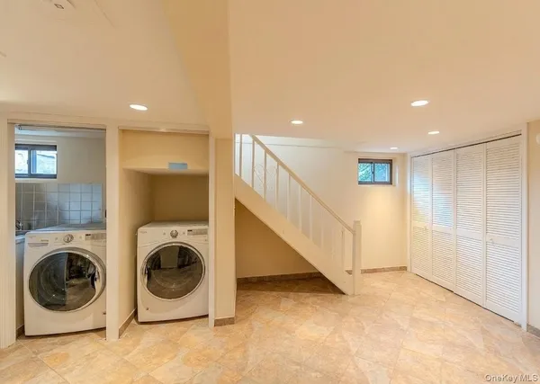 a view of a hallway with washer and dryer