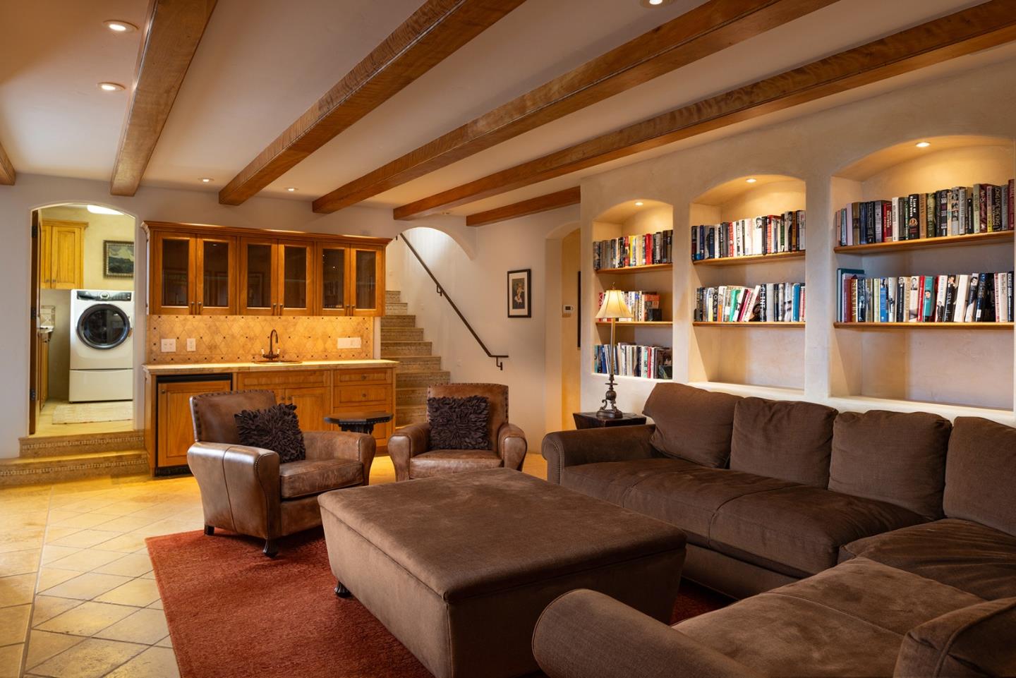 31453 Highway 1 Carmel, CA 93923 - Photo 45 of 58 a living room with furniture and a book shelf