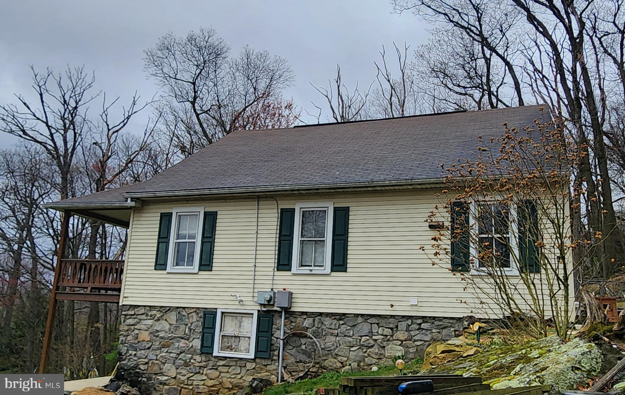24717 Waldheim Road Cascade, MD 21719 - Photo 4 of 12 a front view of a house with garden