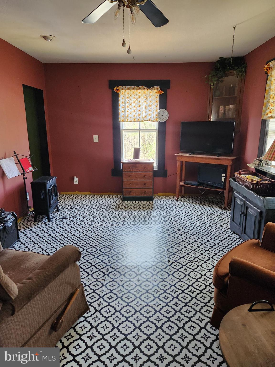 24717 Waldheim Road Cascade, MD 21719 - Photo 7 of 12 a living room with furniture and a flat screen tv