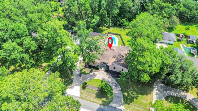 a backyard of a house with a yard and outdoor seating