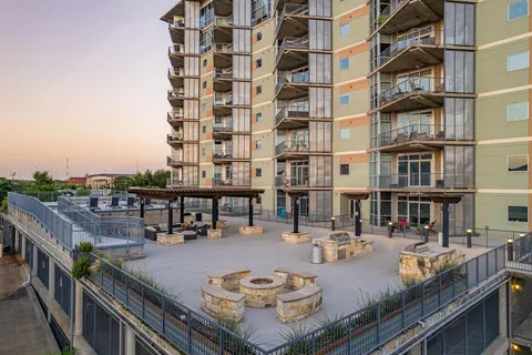 a swimming pool view with a outdoor seating