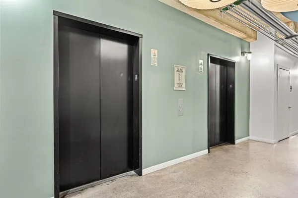 an empty room with closet and wooden floor