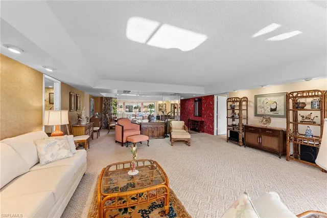 a bed room with furniture and a flat screen tv