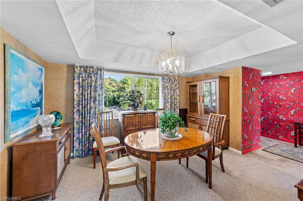 200 Albi Road, Unit 2 Naples, FL 34112 - Photo 17 of 49 a view of a dining room with furniture window and outside view