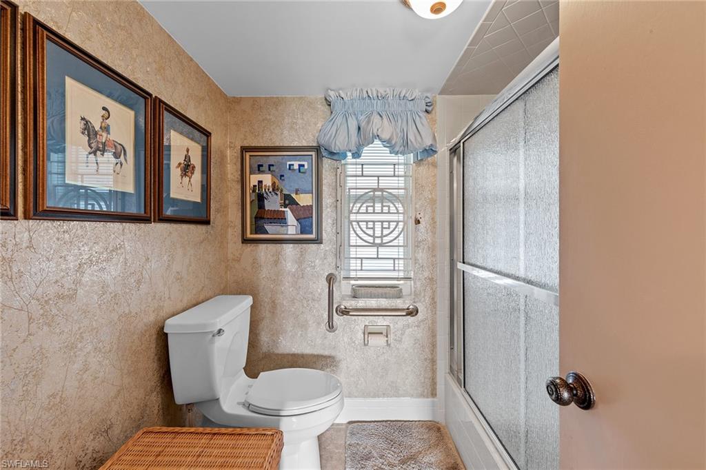 200 Albi Road, Unit 2 Naples, FL 34112 - Photo 26 of 49 a bathroom with a toilet and a shower