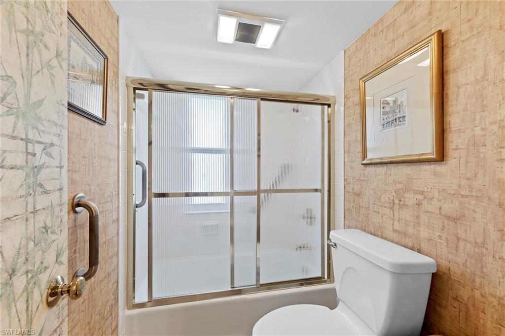 200 Albi Road, Unit 2 Naples, FL 34112 - Photo 31 of 49 a bathroom with a toilet and a shower