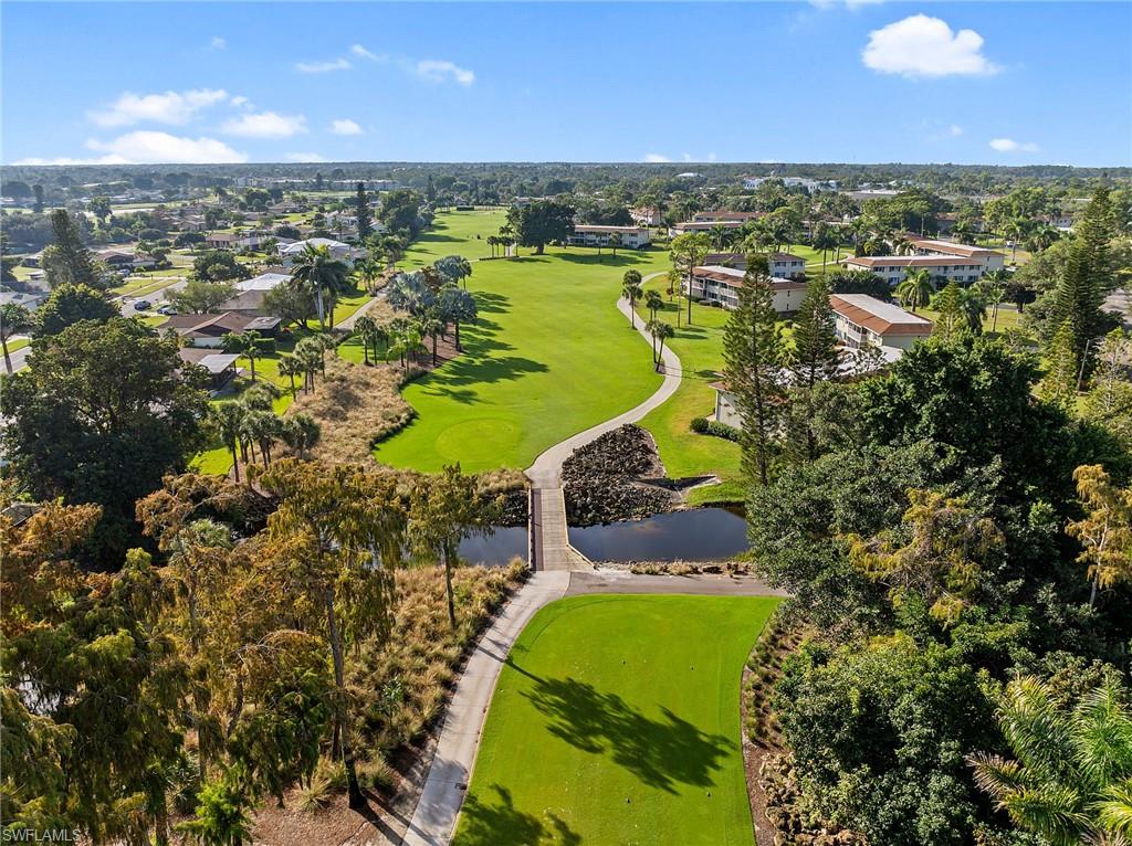 200 Albi Road, Unit 2 Naples, FL 34112 - Photo 32 of 49 an aerial view of a houses with a swimming pool