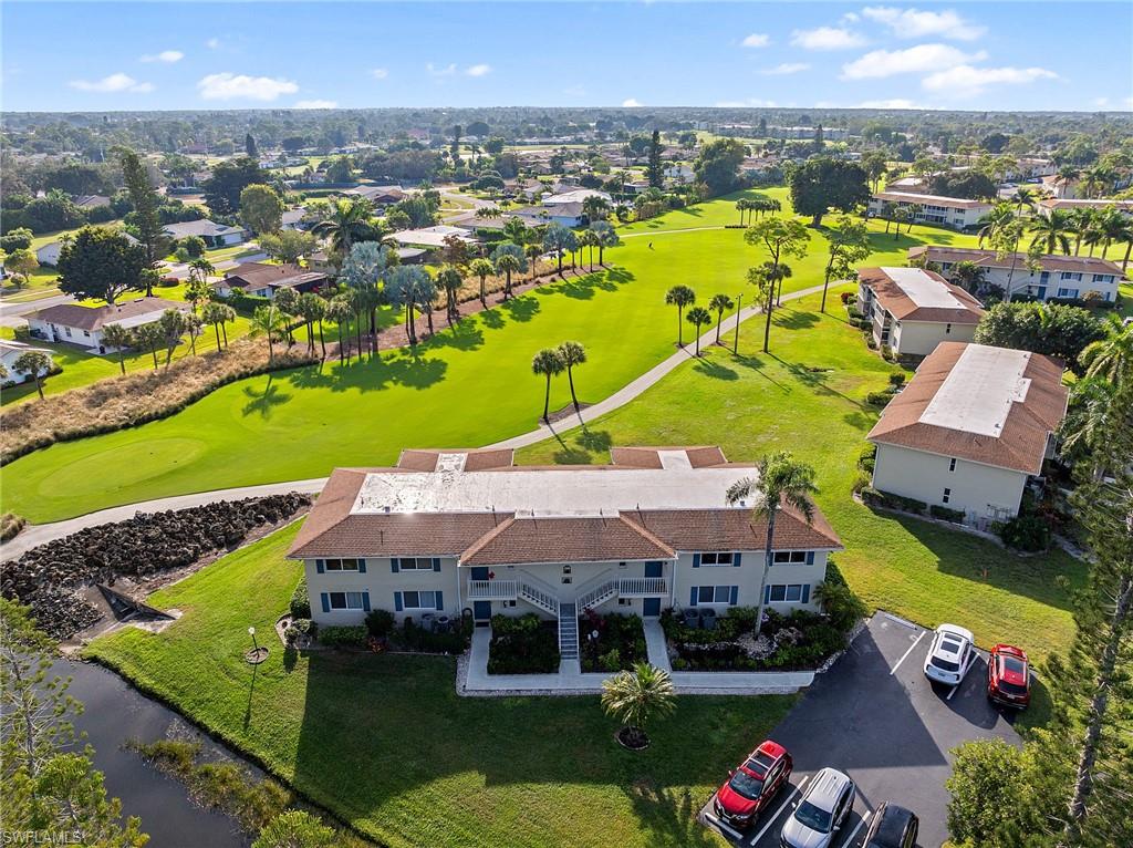 200 Albi Road, Unit 2 Naples, FL 34112 - Photo 34 of 49 an aerial view of a house with a swimming pool yard and outdoor seating