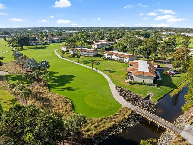 an aerial view of a house with a lake view