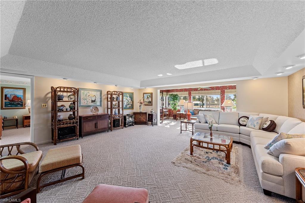 200 Albi Road, Unit 2 Naples, FL 34112 - Photo 10 of 49 a living room with furniture and wooden floor