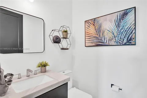 a bathroom with a sink and mirror
