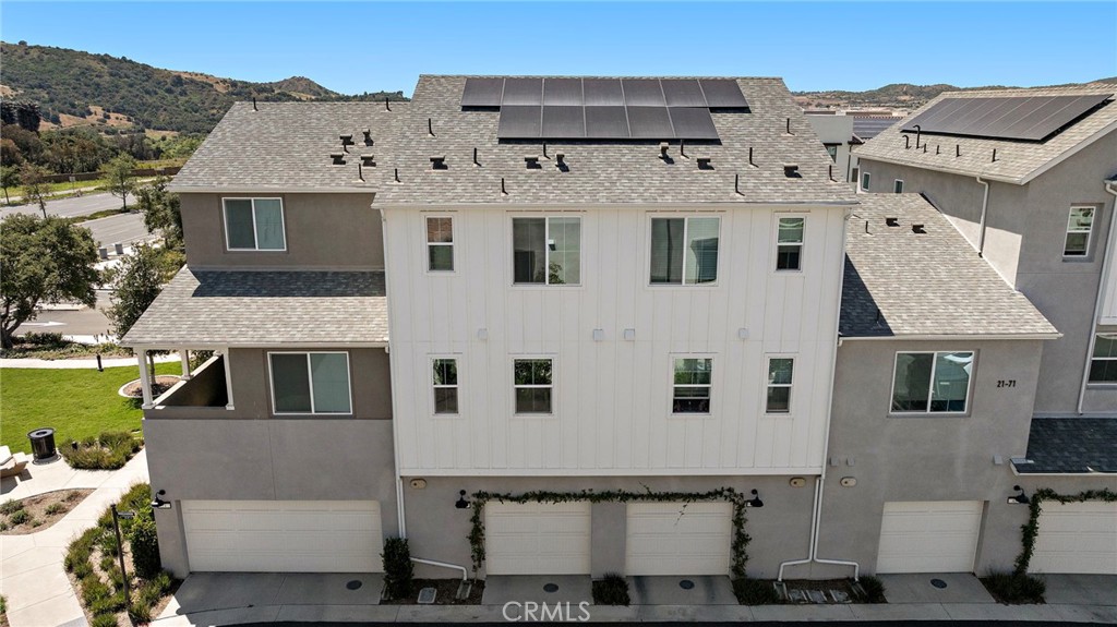 61 Wheelbarrow Road Rancho Mission Viejo, CA 92694 - Photo 36 of 74 a view of a white house with large windows