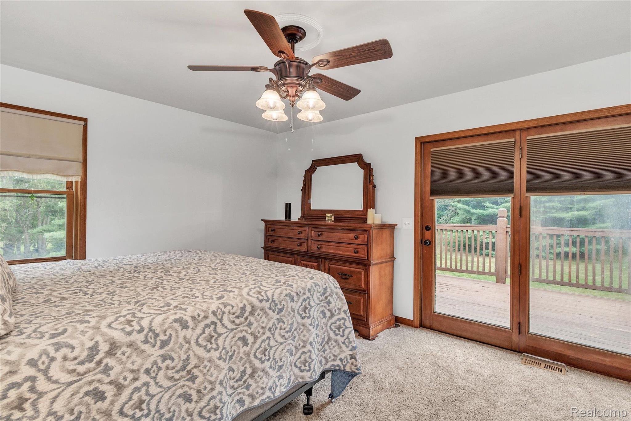 1744 Peavy Road Howell, MI 48843 - Photo 14 of 34 primary bedroom has doors to back deck