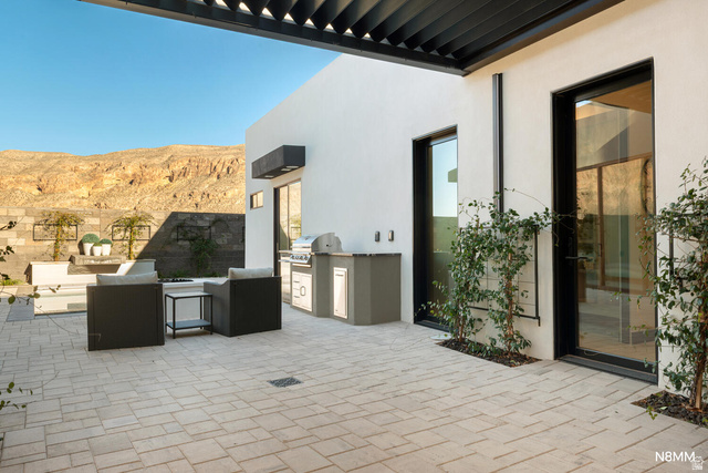 3607 South Cypress Pt Road Hurricane, UT 84737 - Photo 55 of 59 View of patio featuring an outdoor pool, kitchen and area to lounge, a pergola, and a mountain view