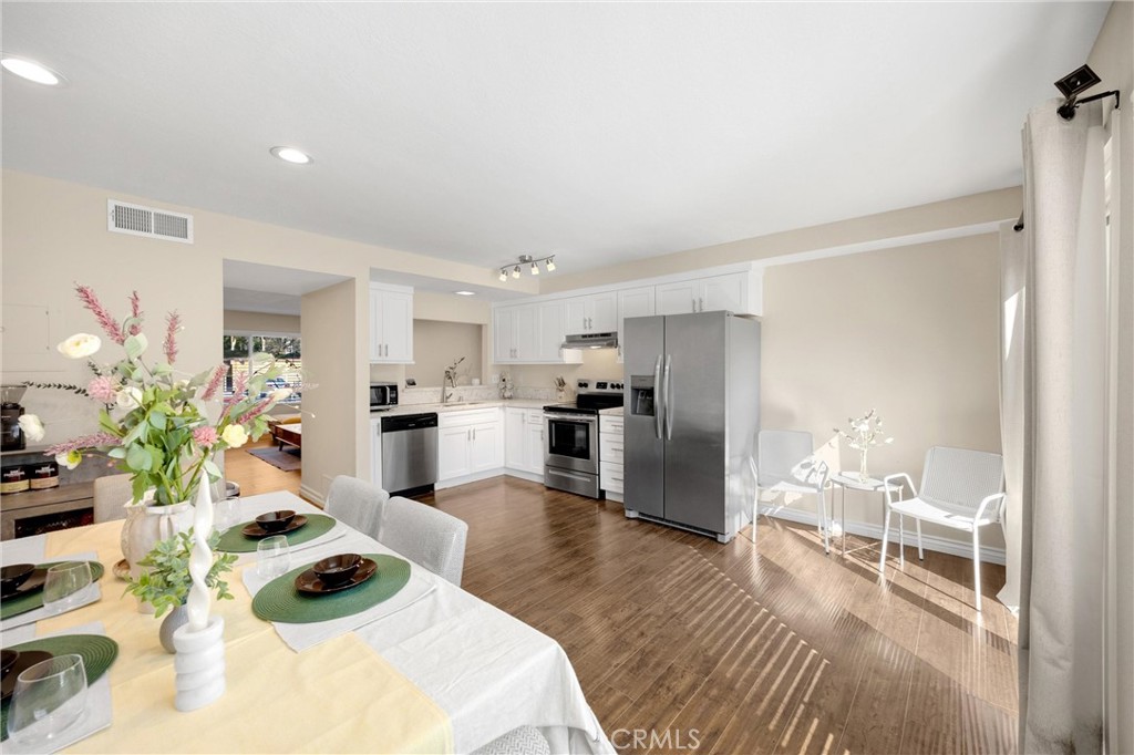 25885 Trabuco Road, Unit 306 Lake Forest, CA 92630 - Photo 11 of 38 a living room with furniture and a kitchen view