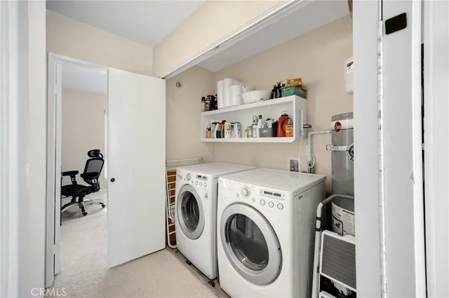 a view of washer and dryer in a utility room