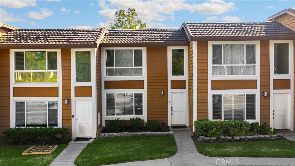 25885 Trabuco Road, Unit 306 Lake Forest, CA 92630 - Photo 27 of 38 a front view of a house with a yard