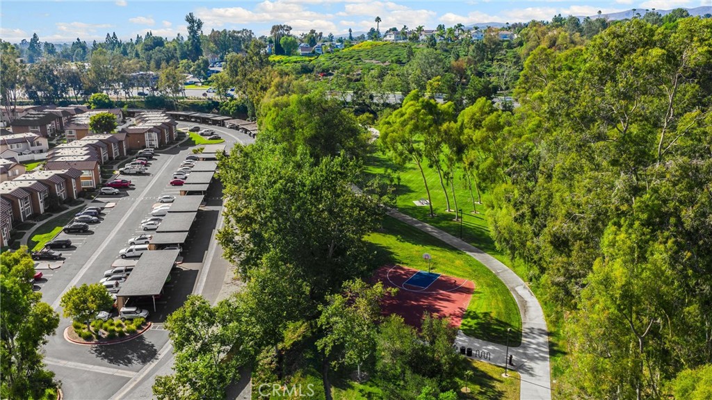 25885 Trabuco Road, Unit 306 Lake Forest, CA 92630 - Photo 35 of 38 an aerial view of residential house with outdoor space and trees all around