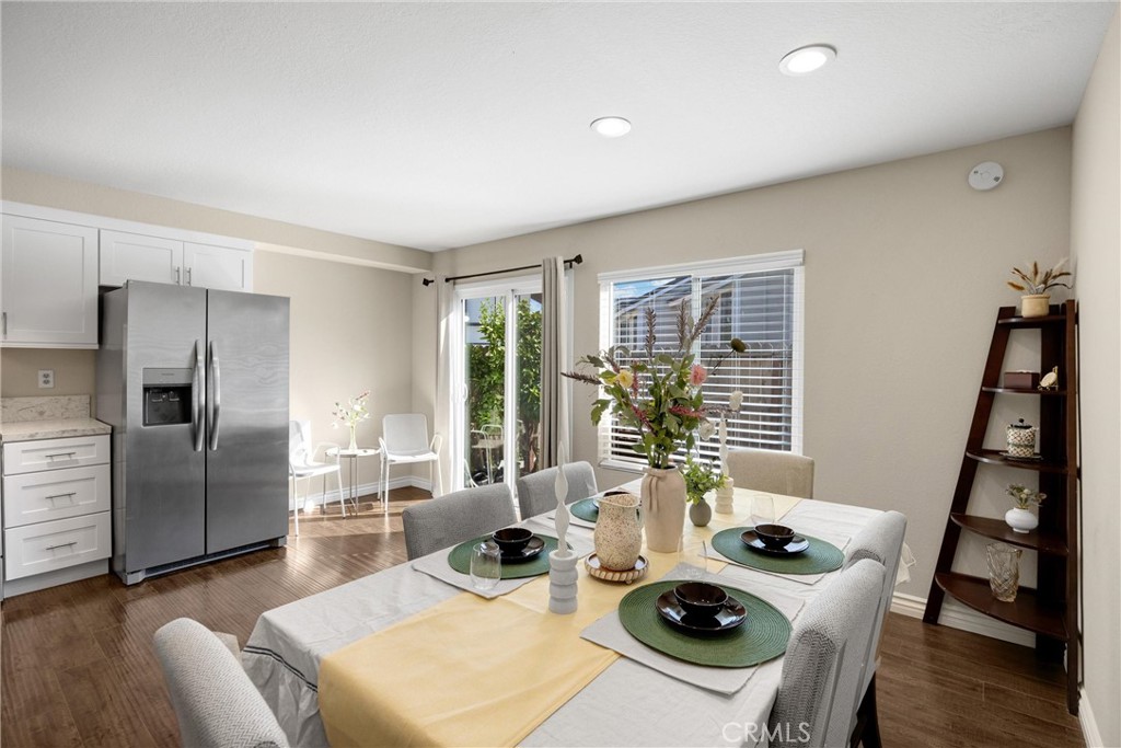 25885 Trabuco Road, Unit 306 Lake Forest, CA 92630 - Photo 10 of 38 a living room with furniture a large window and wood floor