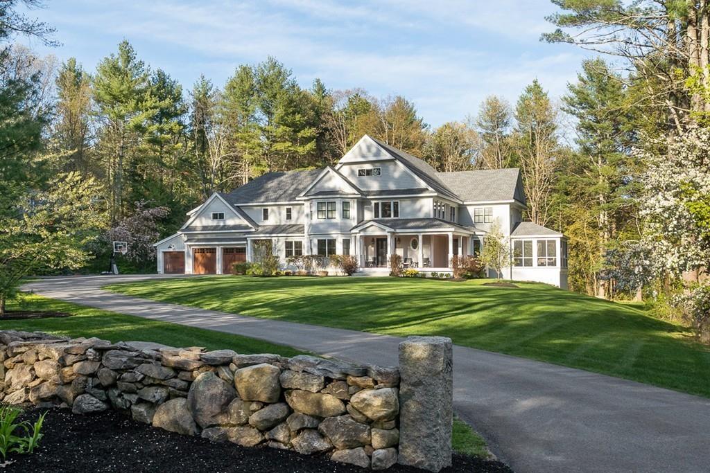 88 Hugh Cargill Road Concord, MA 01742 - Photo 1 of 36 a front view of a house with a garden