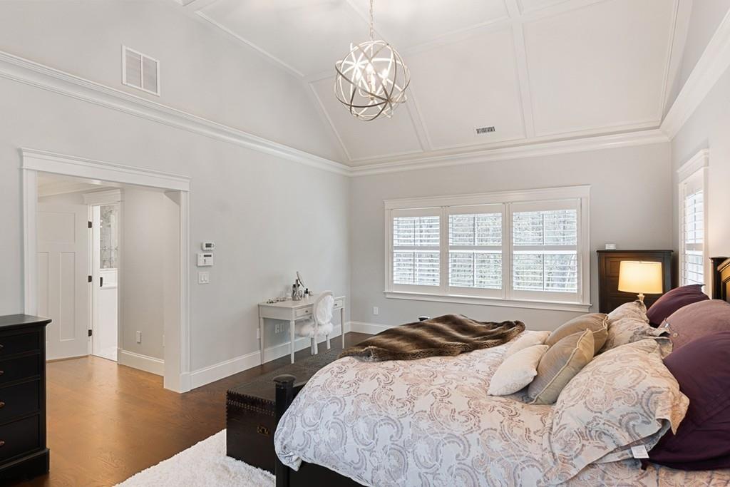 88 Hugh Cargill Road Concord, MA 01742 - Photo 13 of 36 a bedroom with a bed and a chandelier