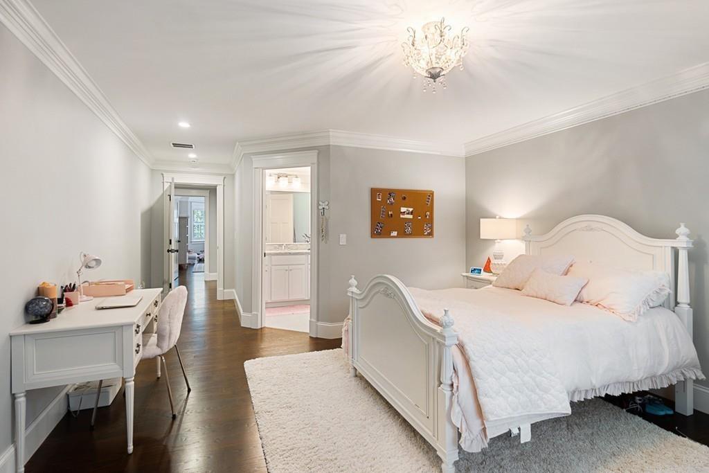 88 Hugh Cargill Road Concord, MA 01742 - Photo 17 of 36 a bedroom with a bed and a chandelier