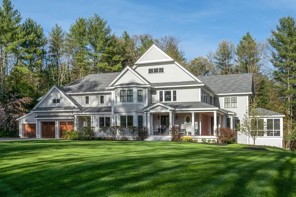 88 Hugh Cargill Road Concord, MA 01742 - Photo 2 of 36 a front view of a house with a garden