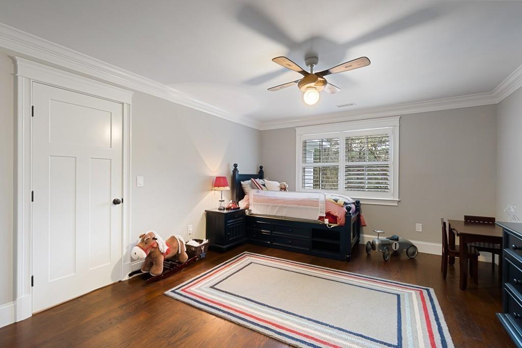 88 Hugh Cargill Road Concord, MA 01742 - Photo 22 of 36 a room with a bed and a wooden floor