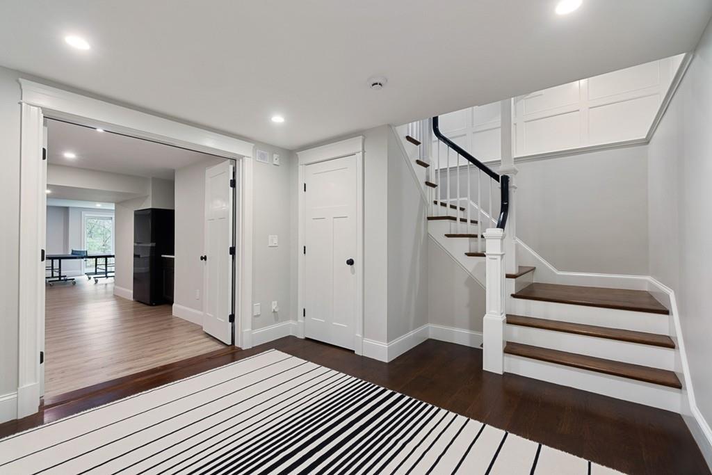 88 Hugh Cargill Road Concord, MA 01742 - Photo 29 of 36 a view of a hallway view with wooden floor and staircase